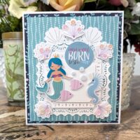 Card Created with the Stitched Shell Cardfront from Spellbinders June 2023 Stitching Die Club